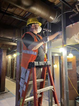 restoration technician performing demo